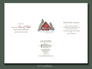Card back with Christmas design featuring a red cabin and tree, and branding information.